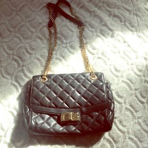 A black Michaelkors leather purse
